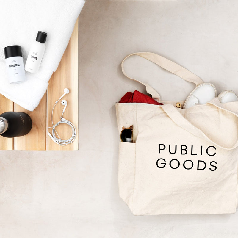 Public Goods Organic Cotton Tote Bag which includes a water bottle holder, zip closure inner pocket, and inner pocket with magnetic clasp.